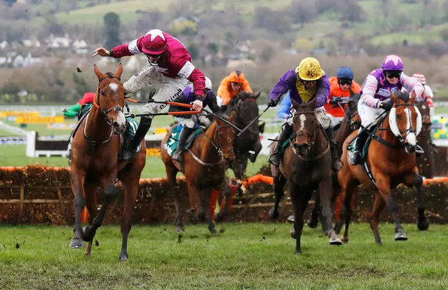 Jack Kennedy falls from Eclair De Beaufeu during the 2.10 Randox Health County Handicap Hurdle at Cheltenham Racecourse on March 15, 2019 in Cheltenham, England. (Photo by Eddie Keogh/Reuters)