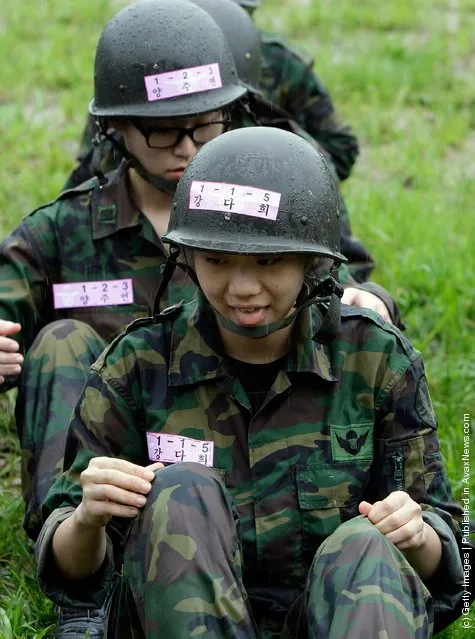 South Korean teenagers participate in a warfare exercise as part of the Special Warfare Command's training course at a military base