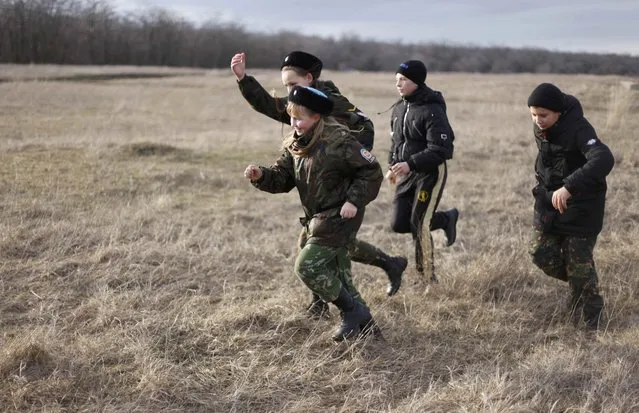 Students of the General Yermolov Cadet School and members of a local youth military patriotic club undergo military training at a boot camp of the Russkiye Vityazi (Russian Knights) military patriotic club in the village of Sengileyevskoye outside Stavropol, Russia February 8, 2017. (Photo by Eduard Korniyenko/Reuters)