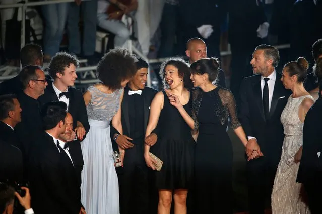(L-R) Scriptwriter Etienne Comar, actor Norman Thavaud, actress Chrystele Saint Louis Augustin, actor Nabil Kechouhen, actress Amanda Added, director Maiwenn, actor Vincent Cassel and Emmanuelle Berco attend the Premiere of “Mon Roi” during the 68th annual Cannes Film Festival on May 17, 2015 in Cannes, France. (Photo by Tristan Fewings/Getty Images)