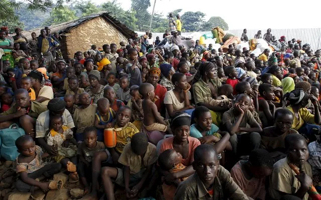 Burundian refugees gather on the shores of Lake Tanganyika in Kagunga village in Kigoma region in western Tanzania, as they wait for MV Liemba to transport them to Kigoma township, May 17, 2015. (Photo by Thomas Mukoya/Reuters)
