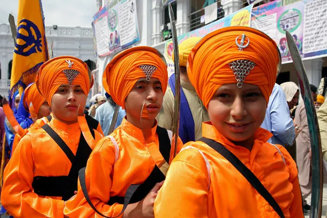 Sikh devotees participate in the Baisakhi festival at Panja Sahib shrine in Hasanabdal, Pakistan April 14, 2019. (Photo by Saiyna Bashir/Reuters)