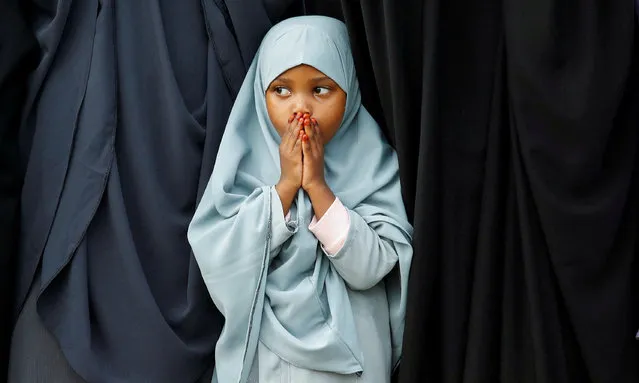 A Muslim girl attends Eid al-Fitr prayers, marking the end of the fasting month of Ramadan, at the Sir Ali Muslim Club Ground, Nairobi, Kenya on April 10, 2024. (Photo by Monicah Mwangi/Reuters)