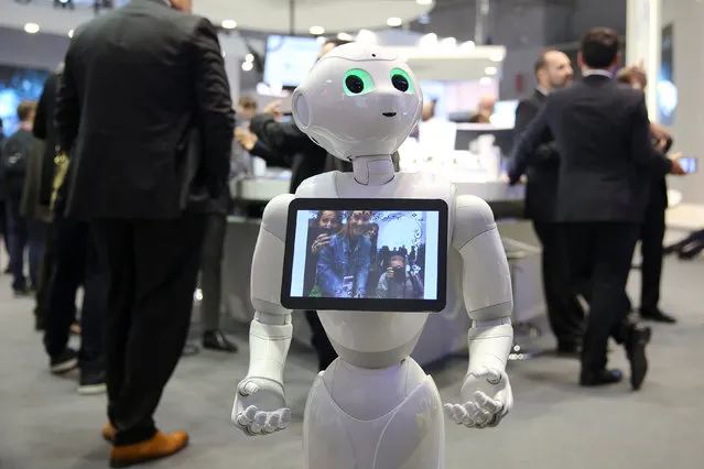 A robot displays a photograph it took of attendees at the Oberthur Technologies stand at the Mobile World Congress in Barcelona, Spain March 1, 2017. (Photo by Paul Hanna/Reuters)