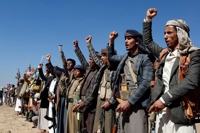 Houthi fighters and tribesmen stage a rally against the U.S. and the U.K. strikes on Houthi-run military sites near Sanaa, Yemen, on Sunday, January 14, 2024. (Photo by AP Photo)