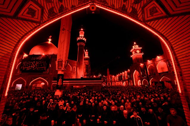 People gather at Imam Ali Holy Shrine for a commemoration ceremony for the upcoming 1363rd death anniversary of Imam Ali ibn Abi Talib, cousin of the Prophet Muhammad and the fourth of the Rashidun, in Najaf, Iraq on April 1, 2024. (Photo by Karar Essa/Anadolu via Getty Images)