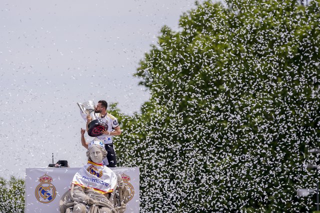 Real Madrid's Nacho Fernandez holds their 36th Liga trophy during celebrations at the Cibeles Square a week after clinching Spanish La Liga soccer title in Madrid, Sunday, May 12, 2024. (Photo by Manu Fernandez/AP Photo)