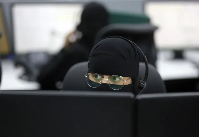 A Saudi police officer receives emergency calls at a call center, ahead of the Hajj pilgrimage in the Muslim holy city of Mecca, Saudi Arabia, Tuesday, August 6, 2019. The hajj occurs once a year during the Islamic lunar month of Dhul-Hijja, the 12th and final month of the Islamic calendar year. (Photo by Amr Nabil/AP Photo)