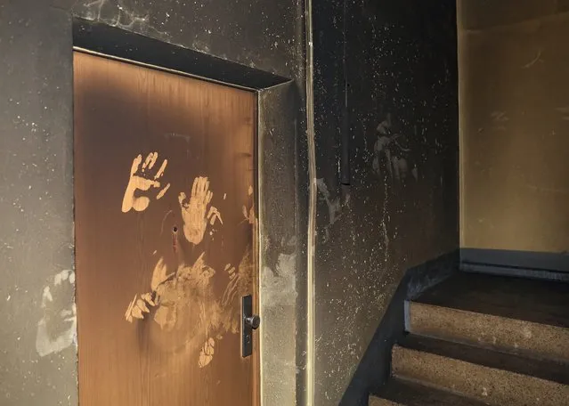 Scorch marks seen in a residential building in Eisleben, Germany, 01 May 2016. Local police suspects a case of serious arson – with a potential xenophobic background since German, Syrian and Afghan families are currently residing in the building among others. (Photo by Jens Wolf/EPA)