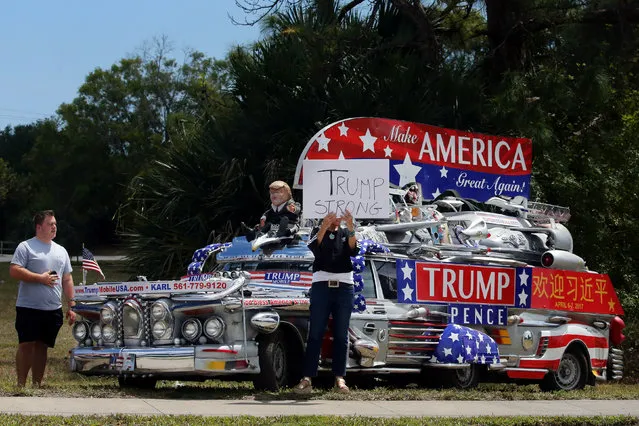 Supporters of U.S. President Donald Trump gather outside of Trump International Golf Club in West Palm Beach, Florida, U.S., April 8, 2017. (Photo by Carlos Barria/Reuters)