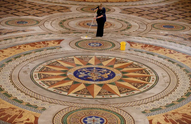 Cleaner Ann Lawler mops the Minton tiled floor of St George's Hall in Liverpool, northern Britain, April 13 , 2017. The floor which was completed in 1850 is usually covered by a protective wooden layer but is going on display to the public over Easter. (Photo by Phil Noble/Reuters)