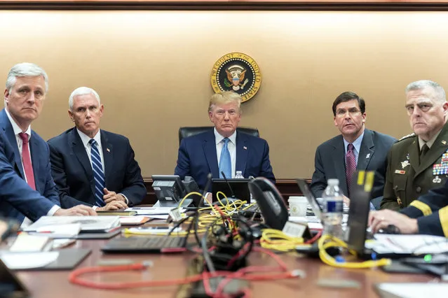 In this image released by the White House, President Donald Trump is joined by Vice President Mike Pence, second from left, national security adviser O'Brien, left; Secretary of Defense Mark Esper, second from right,  and Chairman of the Joint Chiefs of Staff Army Gen. Mark A. Milley, right, Saturday, October 26, 2019, in the Situation Room of the White House monitoring developments as U.S. Special Operations forces close in on Abu Bakr al-Baghdadi's compound in Syria with a mission to kill or capture the terrorist. (Photo by Shealah Craighead/White House via AP Photo)