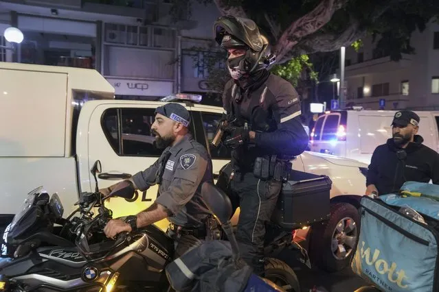 Israeli security forces are looking for assailant near the scene of a shooting attack In Tel Aviv, Israel, Thursday, April 7, 2022. Israeli police say at least two killed, several wounded in a shooting in central Tel Aviv. The shooting on Thursday evening occurred in a crowded area with several bars and restaurants. (Photo by Ariel Schalit/AP Photo)