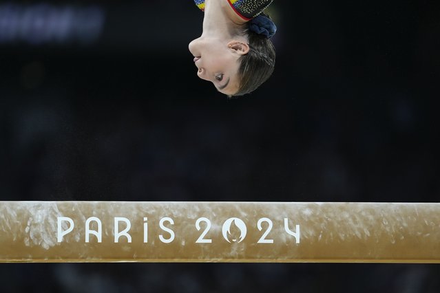 Lilia Cosman, of Romania, competes on the balance beam during a women's artistic gymnastics qualification round at the 2024 Summer Olympics, Sunday, July 28, 2024, in Paris, France. (Photo by Abbie Parr/AP Photo)