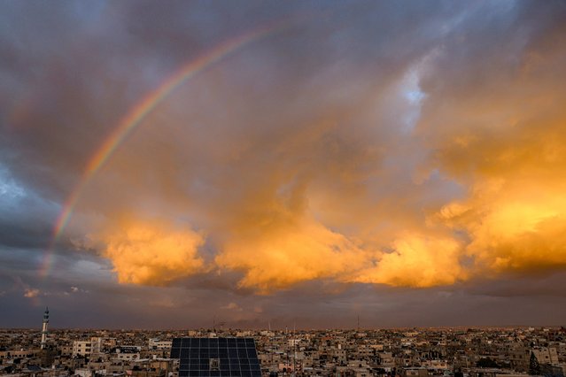 A picture taken from Rafah shows a rainbow over the southern Gaza Strip on January 11, 2024, amid ongoing battles between Israel and Palestinian Hamas militants in the Gaza Strip. (Photo by AFP Photo)