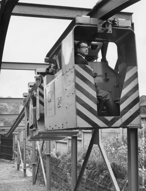 A 'Monorail Locomotive and Man Riding Carriage' devised by Qualter Hall & Co of Yorkshire for use in collieries. It is hoped that it will enable men, supplies and coal to be taken to and from the coal face more quickly, 1965