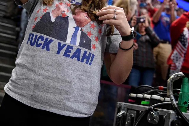 People wait for US President Donald Trump during a Keep America Great rally at the Giant Center in Hershey, Pennsylvania on December 10, 2019. (Photo by Brendan Smialowski/AFP Photo)