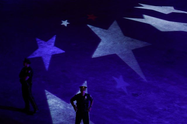 Law enforcement officers stand guard as Republican presidential nominee and former U.S. President Donald Trump attends a Fox News town hall hosted by Sean Hannity in Harrisburg, Pennsylvania, U.S. September 4, 2024. (Photo by Evelyn Hockstein/Reuters)