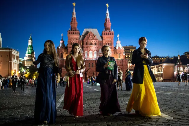 School leavers in Moscow’s Red Square after a graduation ball at the State Kremlin Palace in Moscow, Russia on June 24, 2017. (Photo by Sergei Bobylev/TASS)