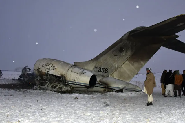 A wreckage of a U.S. military aircraft that crashed in Ghazni province, Afghanistan, is seen Monday, January 27, 2020. The aircraft crashed in Ghazni province on Monday, A U.S. military aircraft crashed in eastern Afghanistan on Monday, an American official said, adding that there were no indications so far it'd been brought down by enemy fire. (Photo by Saifullah Maftoon/AP Photo)
