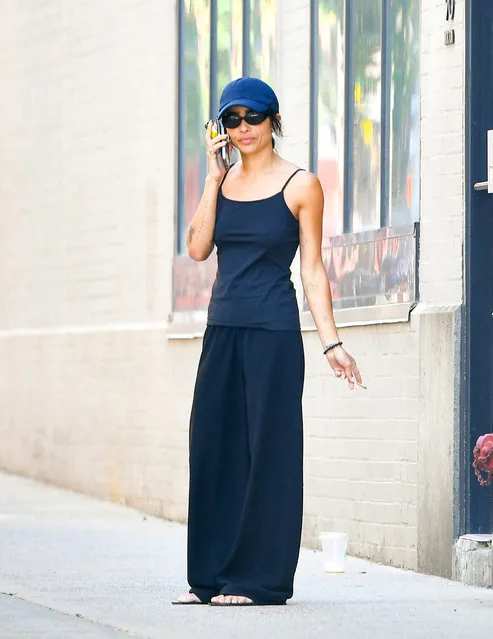 Zoe Kravitz is spotted taking a smoke break in New York City on August 24, 2022. The 33 year old actress wore a baseball cap, dark blue tank top, black trousers, and sandals. (Photo by The Image Direct)