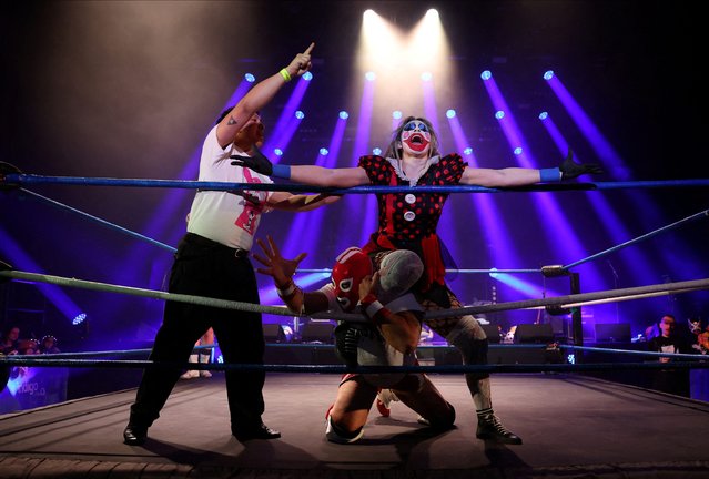 Wrestlers participate in the Christmas Slaycation, a live heavy metal and high-flying wrestling show featuring masked performers, at the O2, in London, Britain, on December 28, 2024. (Photo by Isabel Infantes/Reuters)