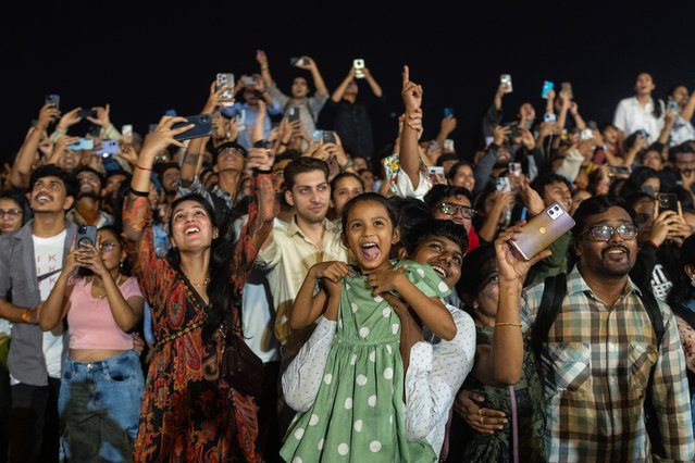 People celebrate the arrival of the New Year at Marine Drive in Mumbai, India, Wednesday, January 1, 2025. (Photo by Rafiq Maqbool/AP Photo)