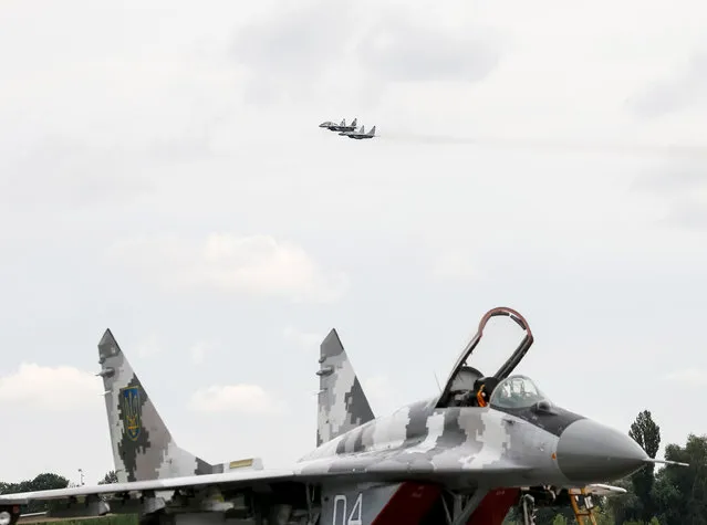 MIG-29 fighter aircrafts fly at a military air base in Vasylkiv, Ukraine, August 3, 2016. (Photo by Gleb Garanich/Reuters)