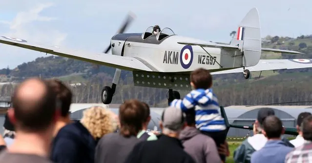 A vintage plane performs during an airshow commemorating the completion of the rebuild of Havilland Mosquito KA 114, on September 29, 2012 in Ardmore, New Zealand. The plane was restored by Warbird Restorations at Ardmore Aerodrome and is the only flying Mosquito in the world.  (Photo by Simon Watts)