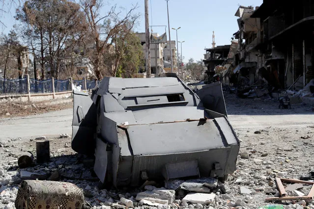 A vehicle of the Islamic State militants used for suicide car bombing is pictured along a road in Raqqa, Syria October 18, 2017. (Photo by Erik De Castro/Reuters)