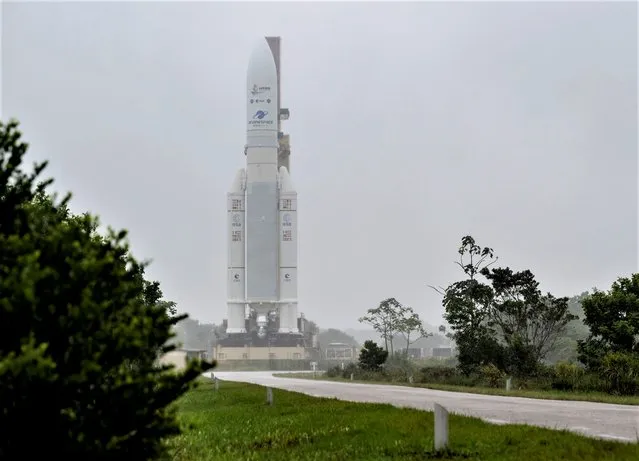 In this handout image provided by the U.S. National Aeronatics and Space Administration (NASA), Arianespace's Ariane 5 rocket with NASAs James Webb Space Telescope onboard, is rolled out to the launch pad on December 23, 2021, at Europes Spaceport, the Guiana Space Center in Kourou, French Guiana. The James Webb Space Telescope (sometimes called JWST or Webb) is a large infrared telescope with a 21.3 foot (6.5 meter) primary mirror. The observatory will study every phase of cosmic history from within our solar system to the most distant observable galaxies in the early universe. (NASA/Bill Ingalls). (Photo by Bill Ingalls/NASA via Getty Images)