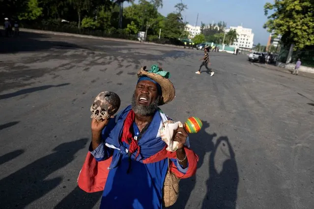 A man protests against Haitian Prime Minister Ariel Henry after he visited the National Pantheon Museum to honor revolutionary leaders Alexandre Petion and Jean Jacques Dessalines in Port-au-Prince, Haiti on October 17, 2022. (Photo by Ricardo Arduengo/Reuters)