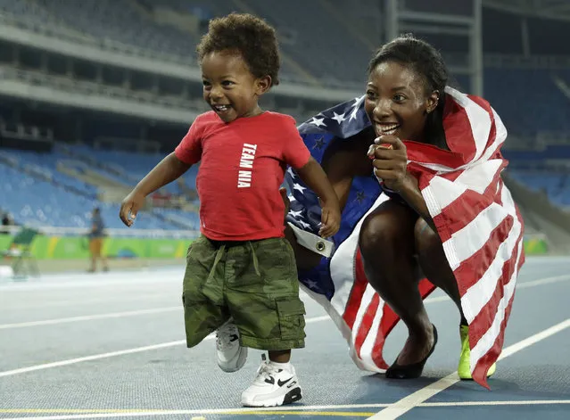 United States' silver medal winner Nia Ali poses with her 15-months old son Titus after the women's 100-meter hurdles final, during the athletics competitions of the 2016 Summer Olympics at the Olympic stadium in Rio de Janeiro, Brazil, Wednesday, August 17, 2016. (Photo by Matt Dunham/AP Photo)