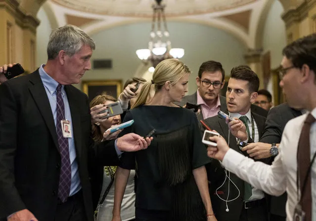 During a day of talking about the Republican tax bill, Ivanka Trump walks by a crowd of journalists at the U.S. Capitol on November 9, 2017 in Washington, DC. Ivanka Trump was seen leaving the offices of Senate Majority Whip John Cornyn. (Photo by Melina Mara/The Washington Post)