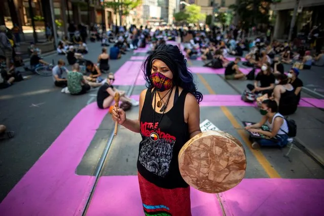 Mahlikah Awe:ri takes part in an “Abolish the police” sit in to mark Juneteenth, which commemorates the end of slavery in Texas, two years after the 1863 Emancipation Proclamation freed slaves elsewhere in the United States, amid nationwide protests against racial inequality in Toronto, Ontario, Canada on June 19, 2020. (Photo by Carlos Osorio/Reuters)