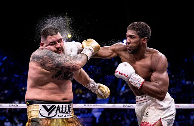 Overall winner. Anthony Joshua (right) punches Andy Ruiz Jr during their world heavyweight title fight in Diriyah, Saudi Arabia. (Photo by Richard Heathcote/Getty Images)
