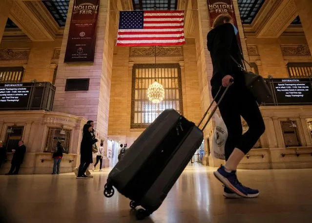 Travelers navigate through Grand Central Terminal, as people begin to travel ahead of the Thanksgiving holiday, in New York City, U.S., November 23, 2022. (Photo by Brendan McDermid/Reuters)