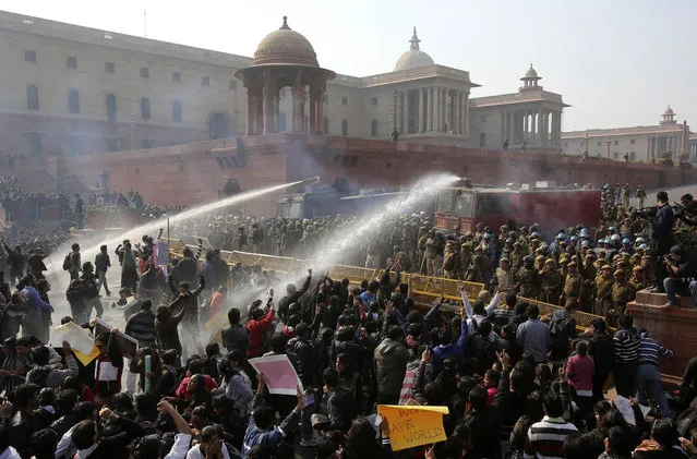 Police use water cannons to disperse demonstrators near the presidential palace in New Delhi, on December 22, 2012. (Photo by Adnan Abidi/Reuters)