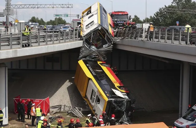 The wreckage of a Warsaw city bus is shown after the articulated bus crashed off an overpass, killing one person and injuring about 20 people, in Warsaw, Poland, on June 25, 2020. The accident forced Warsaw Mayor Rafal Trzaskowski, who is a runner-up candidate in Sunday presidential election, to suspend his campaigning. (Photo by Czarek Sokolowski/AP Photo)