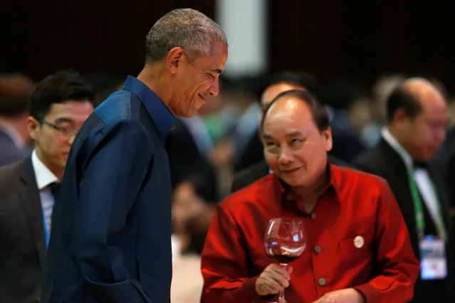 U.S. President Barack Obama smiles as he chats with Vietnam's Prime Minister Nguyen Xuan Phuc during the ASEAN Summit gala dinner in Vientiane, Laos September 7, 2016. (Photo by Jonathan Ernst/Reuters)