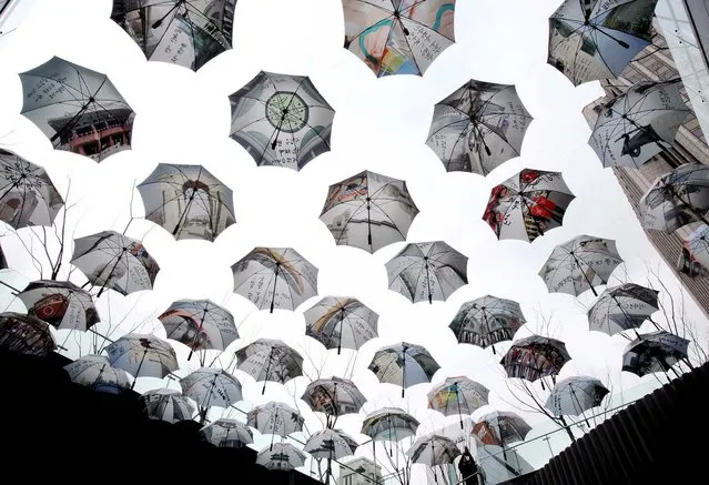 Umbrellas displayed in front of Seoul City Hall are meant to symbolize public officials' intention to be an umbrella for the city's citizens, January 22, 2013. (Photo by Ahn Young-joon/Associated Press)