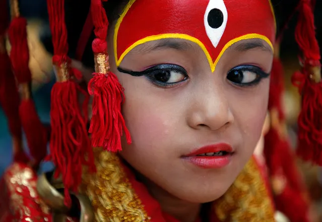 A young girl dressed as the Living Goddess Kumari takes part in the Kumari Puja festival in Kathmandu, Nepal September 14, 2016. (Photo by Navesh Chitrakar/Reuters)