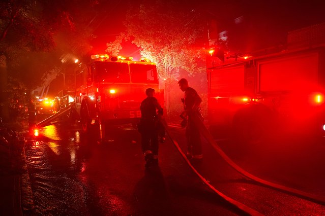 A devastating fire erupted just before 7:30p.m. today at a multifamily home on Devoe Terrace in the Bronx, NYC rapidly spreading to two adjacent properties. Emergency crews escalated the response to a fivealarm blaze. In total, 14 individuals were hospitalizedincluding one firefighter, who remains in critical conditionalongside 13 civilians with varying injuries. The FDNY is conducting an investigation to determine the cause (Photo by Lokman Vural Elibol/Anadolu via Getty Images)