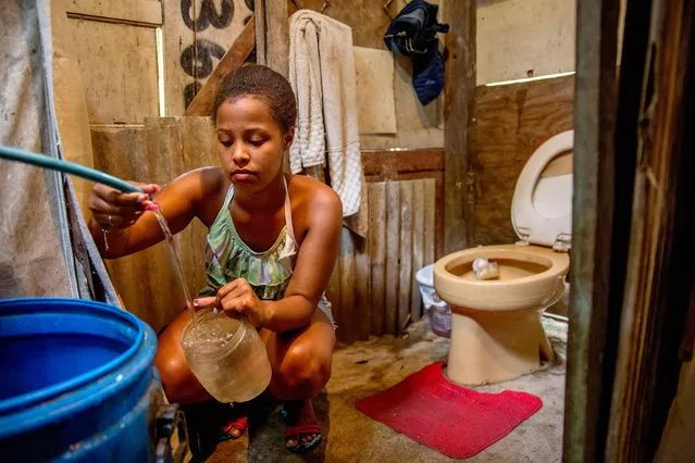 Brazil. Lorena, 16, is a student. She has just moved into one of Rio de Janeiro's favelas. “I don’t have a toilet but I am working hard to try and build one. In the meantime, I have to use my mother's. We only get water on Thursdays and Sundays, when the taps are opened. One day I would like to have a bathroom with running water. I am very vain, I like to have my hair and nails done and use perfume. Some people around here have been in poor health, partly due to the poor sanitation situation in the area”. (Photo by Eduardo Martino/WSUP/Panos)