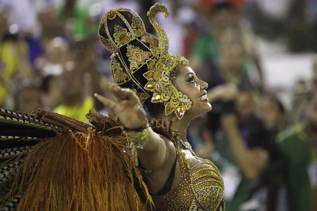 Drum queen Camila Silva from Mocidade samba school performs during the Carnival parade at the Sambadrome in Rio de Janeiro, Brazil, Monday, February 12, 2018. (Photo by Leo Correa/AP Photo)