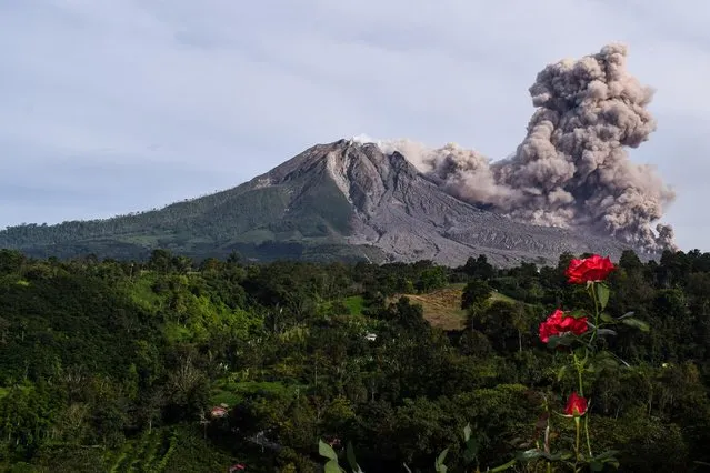 Photo taken on October 29, 2020 shows Mount Sinabung spewing volcanic materials at Tiga Pancur village in Karo, North Sumatra, Indonesia. (Photo by Anto Sembiring/Xinhua News Agency)