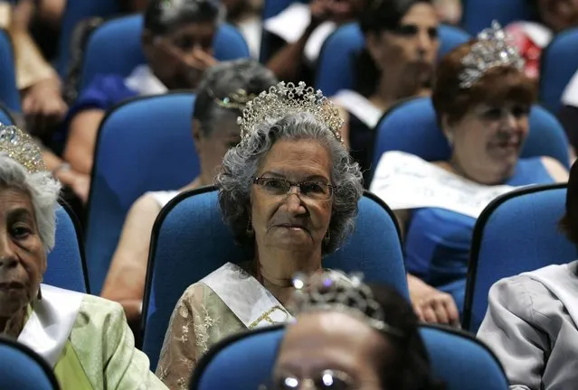 Elderly women wearing tiaras sit in the audience during a beauty pageant for elderly women called the “Queen of the Elderly” in Guadalajara, Mexico, on April 17, 2013. Eight contestants, ranging in age from 65-75, answered questions about their lives and what it means to be a senior citizen in today's society, as they competed in the annual event to win the top prize of a handbag and jewellery creations by local designers. (Photo by Alejandro Acosta/Reuters)