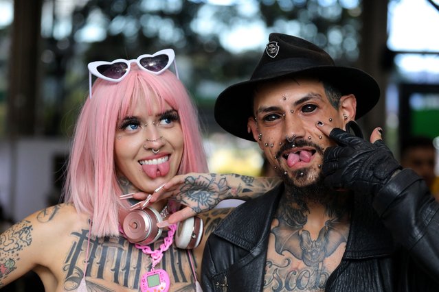 Tattoo enthusiasts pose for a photo during the 14th Expotattoo Colombia Fair in Medellin, Colombia, on May 26, 2024. (Photo by Jaime Saldarriaga/AFP Photo)