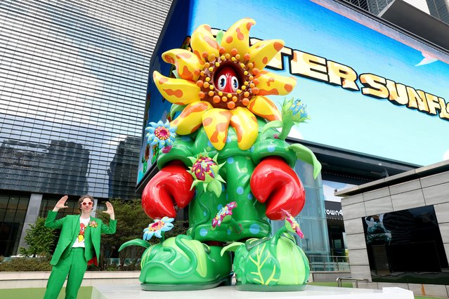 Philip Colbert poses with his monumental steel sculpture and video installation titled “Lobster Sunflower” at COEX K-POP Square, presented by COEX ART PROJECT on September 02, 2025 in Seoul, South Korea. (Photo by Chung Sung-Jun/Getty Images for Philip Colbert)