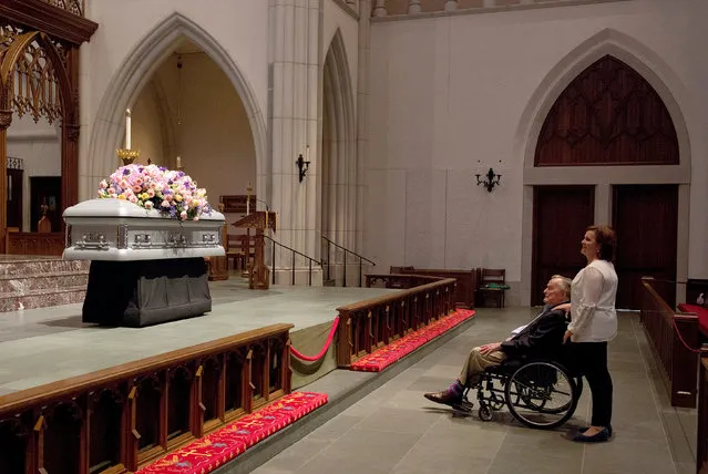 Former U.S. President George H. W. Bush looks at the casket of his late wife, former first lady Barbara Bush with his daughter Dorothy “Doro” Bush Koch during the visitation at St. Martin's Episcopal Church in Houston, Texas, U.S. April 20, 2018. (Photo by Mark Burns/Reuters/Office of George H.W. Bush)
